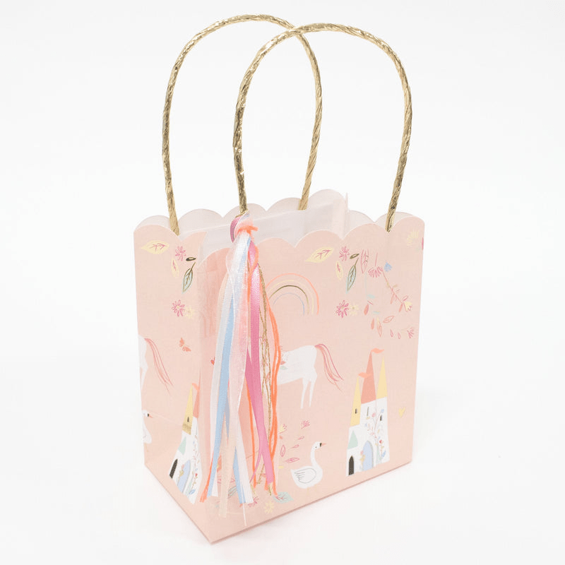 Pink unicorn gift bag with rainbows and castle design for birthday from Parte Haus party supply store in Bethesda MD