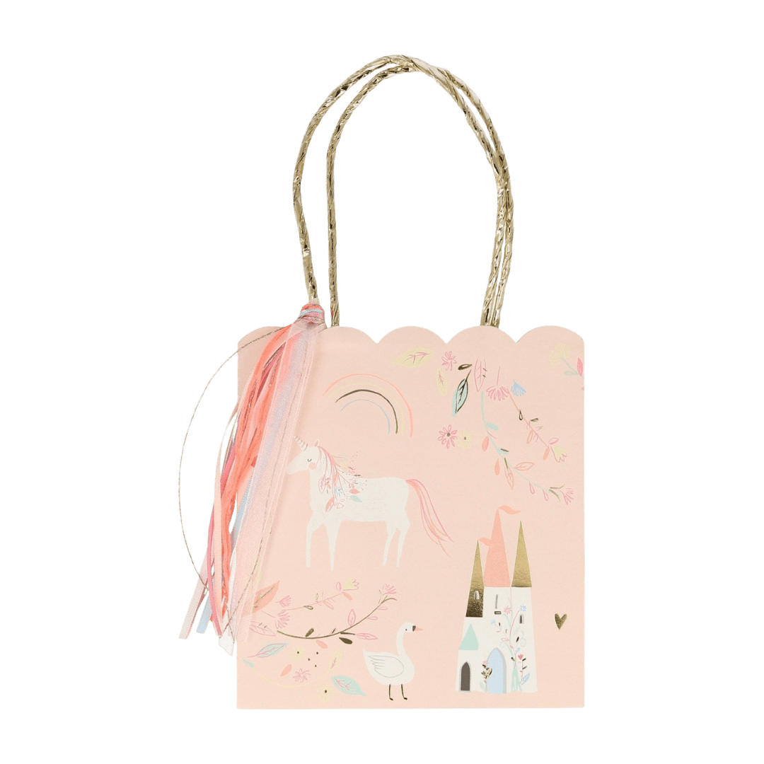 Pastel pink unicorn gift bag with castle and rainbow design fairy tale theme from Parte Haus party supply store in Bethesda MD