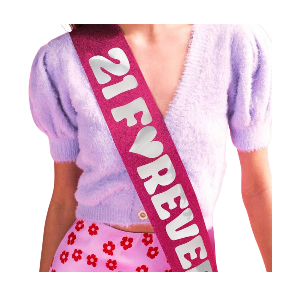 Pink glitter birthday sash with 21 Forever text for birthday party from Parte Haus party supply store in Bethesda MD