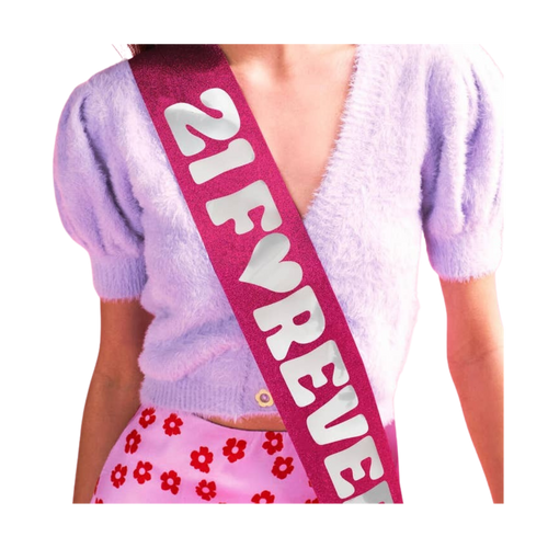 Pink glitter birthday sash with 21 Forever text for birthday party from Parte Haus party supply store in Bethesda MD