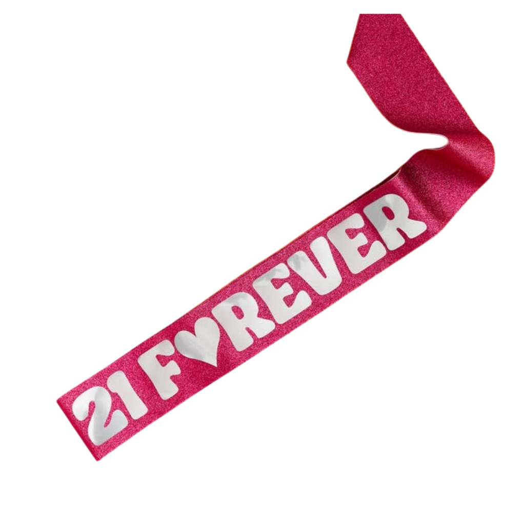 Pink glitter birthday sash with white 21 Forever lettering from Parte Haus party supply store in Bethesda MD