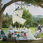White pirate themed table and sail outdoor kids birthday decor from Parte Haus party supply store in Bethesda Maryland
