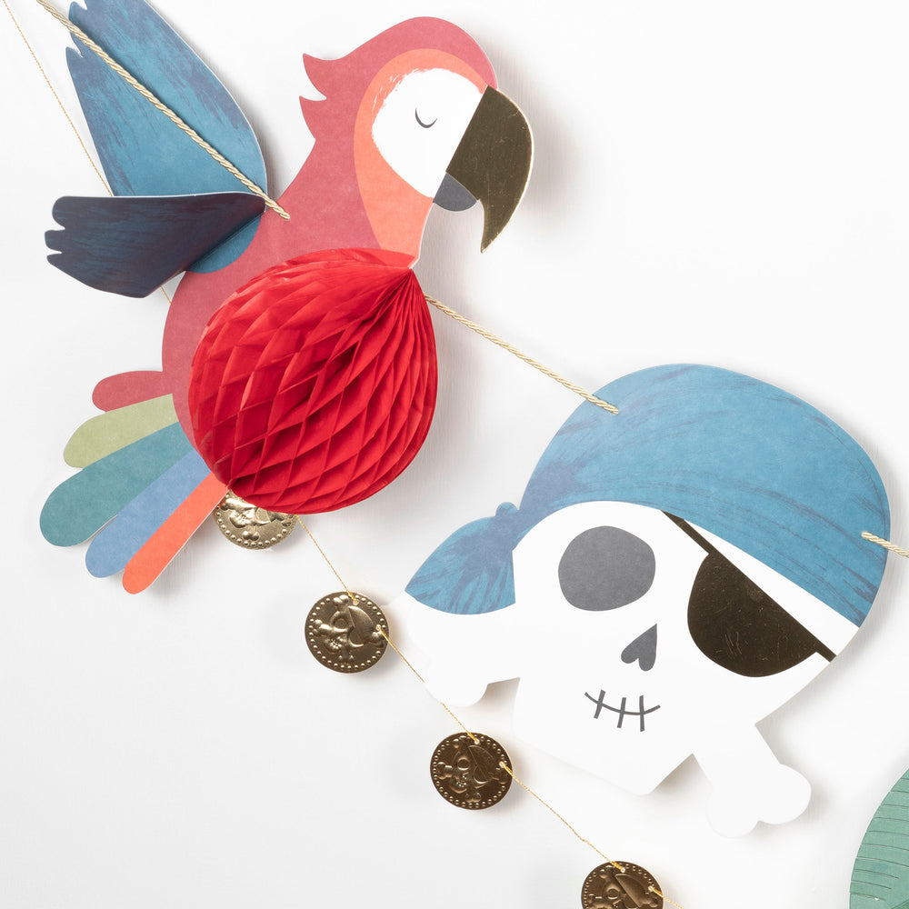 Colorful pirate garland with red parrot and blue skull for kids birthday from Parte Haus party supply store in Bethesda MD