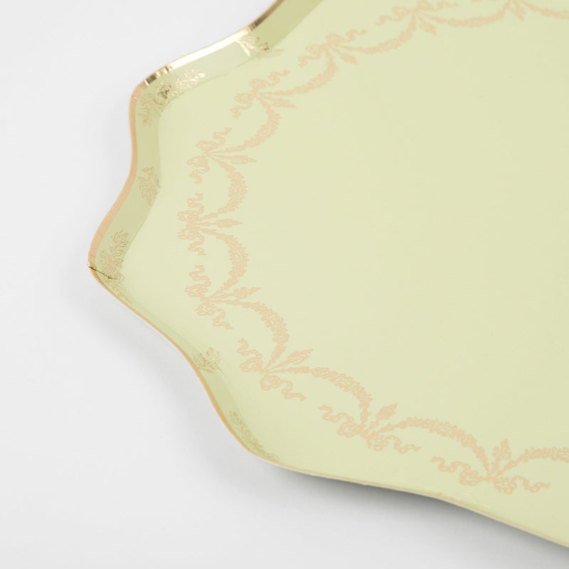 Pale yellow decorative plate with gold scalloped edge for elegant events from Parte Haus party supply store in Bethesda Maryland