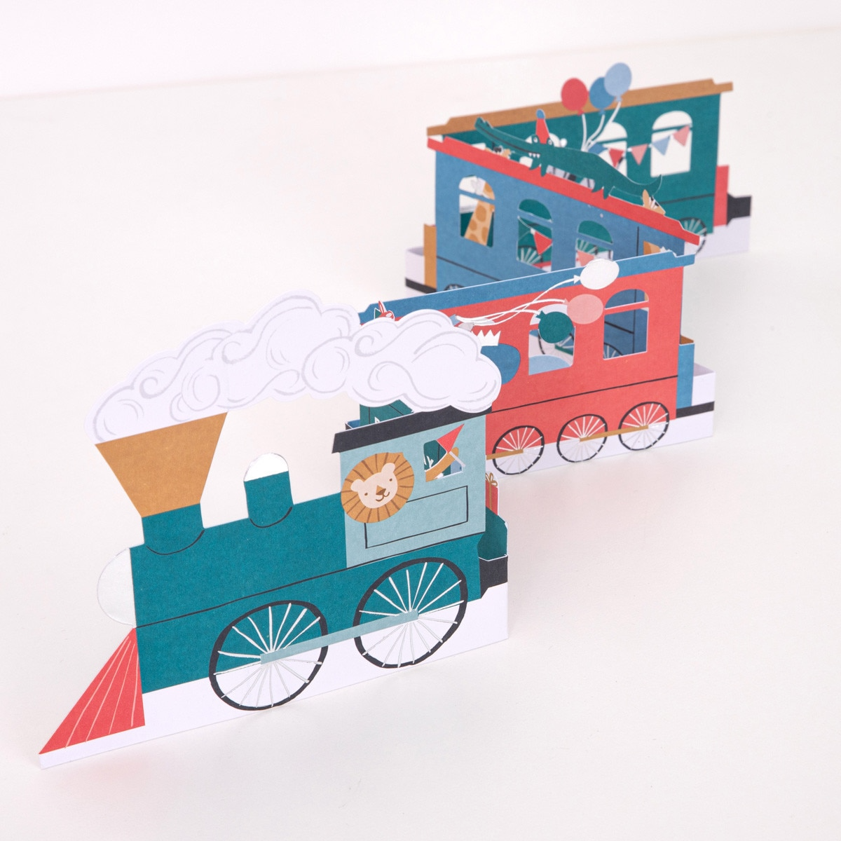 Blue and red train centerpiece with animal and balloon designs circus birthday theme from Parte Haus party supply store in Bethesda Maryland