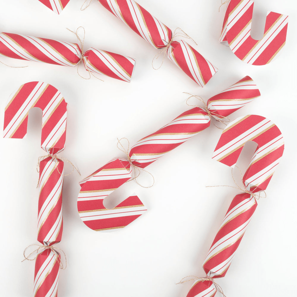 Red and white striped candy cane shaped Christmas crackers for holiday decor from Parte Haus party supply store in Bethesda MD