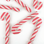 Red and white striped candy cane shaped Christmas crackers for holiday decor from Parte Haus party supply store in Bethesda MD
