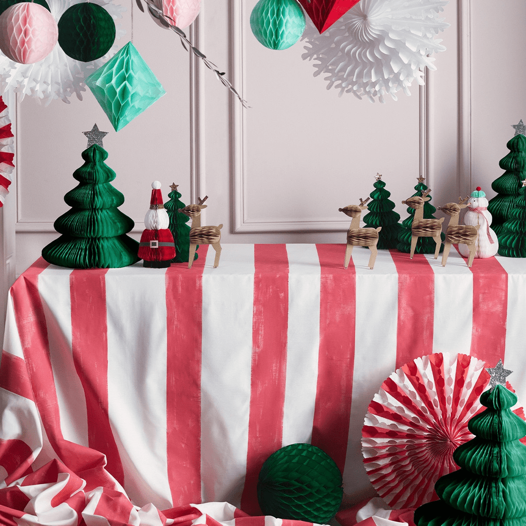 Red and white striped Christmas table display with green paper trees and reindeer for holiday decor from Parte Haus party supply store in Bethesda Maryland