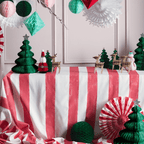 Red and white striped Christmas table display with green paper trees and reindeer for holiday decor from Parte Haus party supply store in Bethesda Maryland