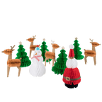 Red green and white honeycomb paper Christmas decorations featuring Santa snowman trees and reindeer for holiday decor from Parte Haus party supply store in Bethesda Maryland