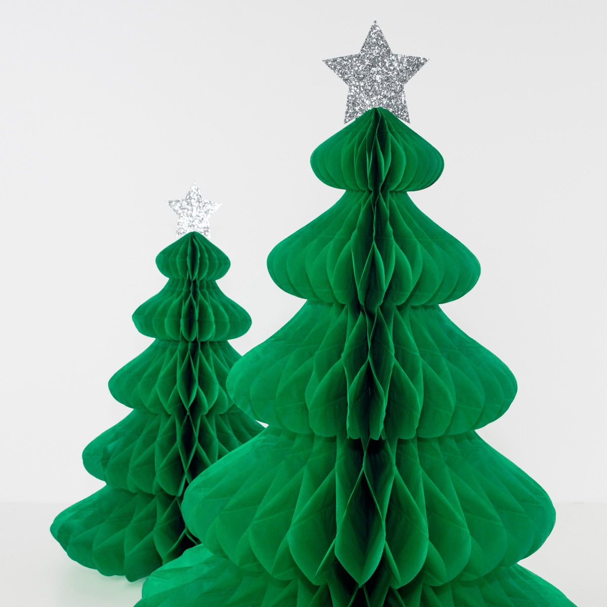 Green Christmas tree honeycomb decorations with silver star topper for holiday from Parte Haus party supply store in Bethesda Maryland