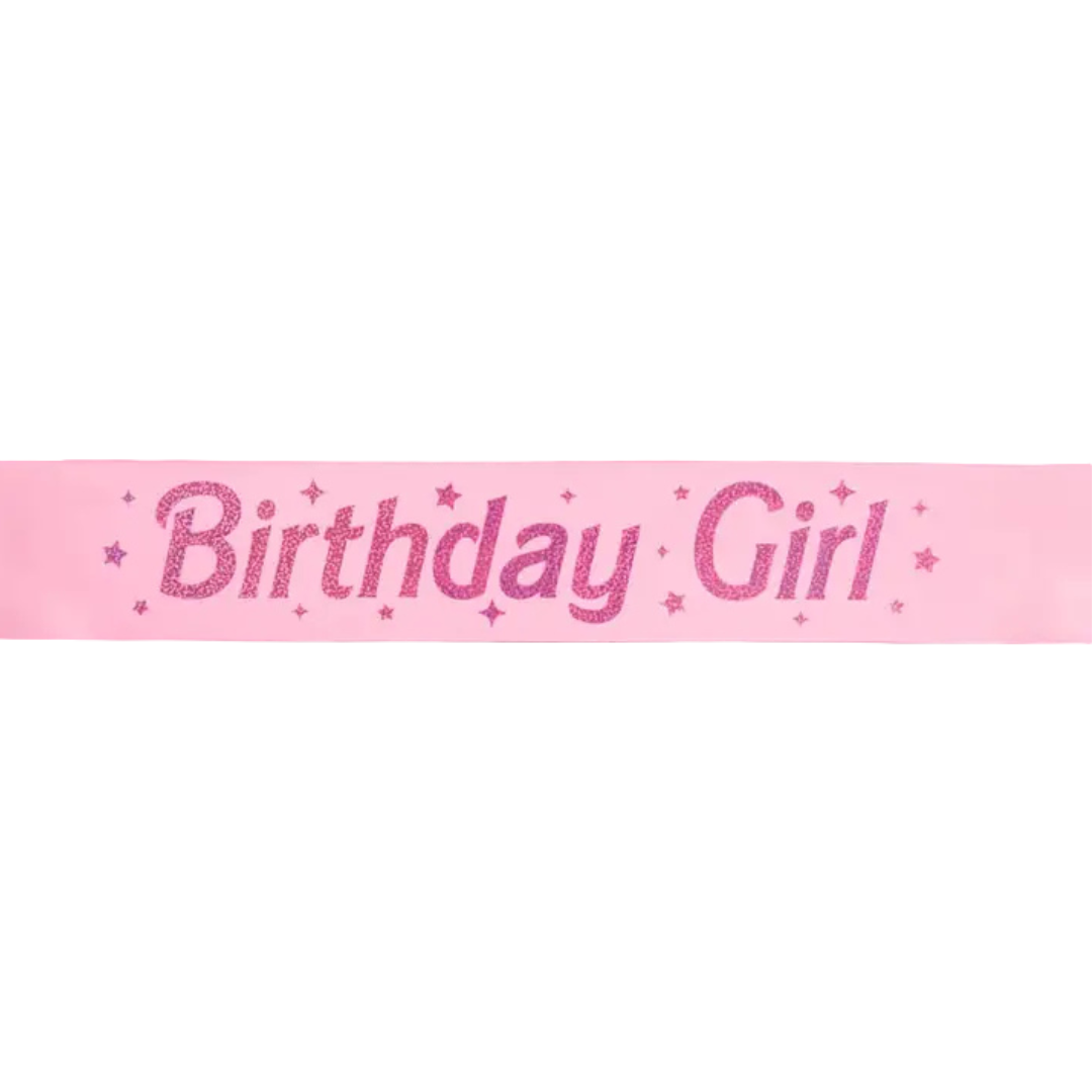 Pink Birthday Girl sash with glitter stars for birthday celebration from Parte Haus party supply store in Bethesda MD