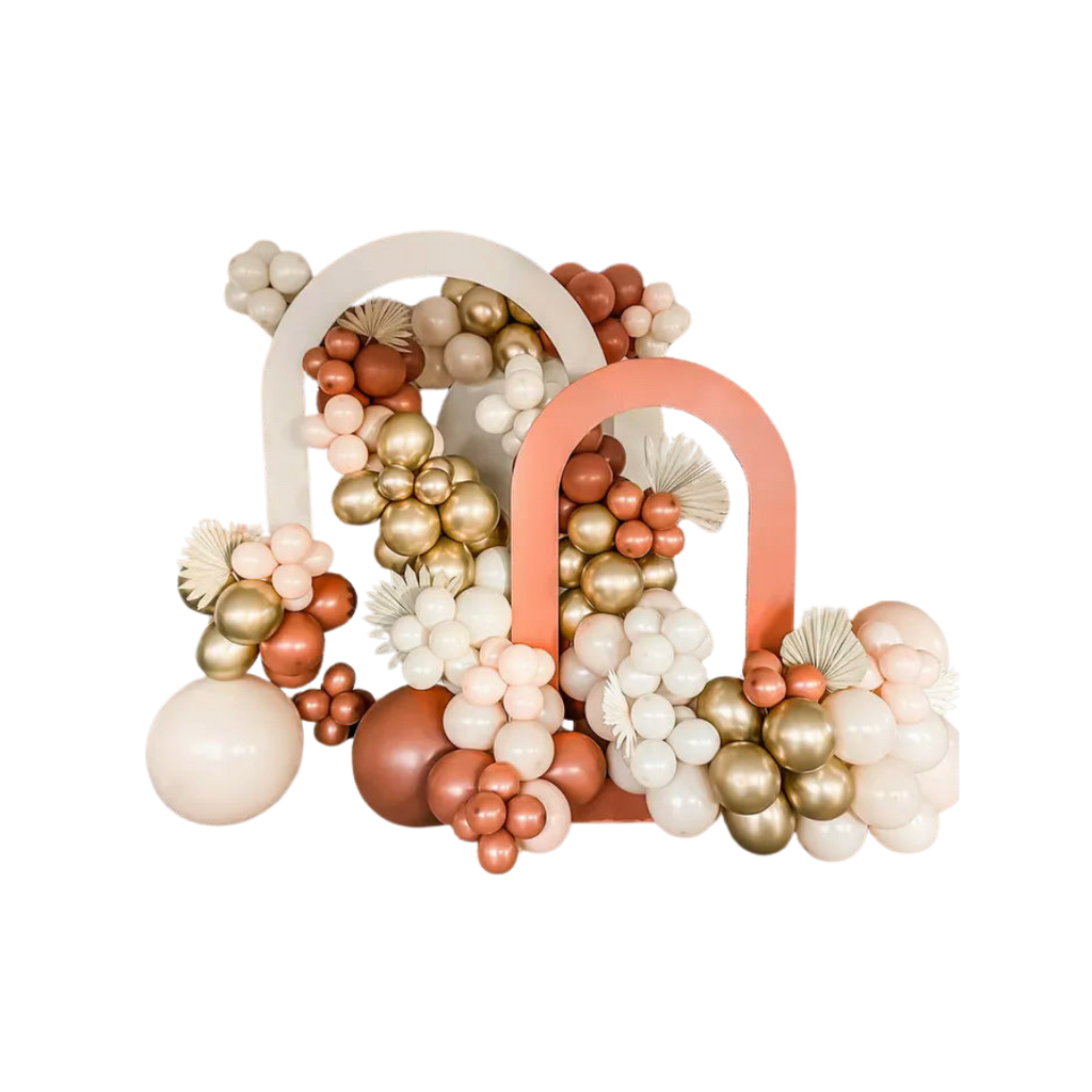 Peach gold and ivory balloon arch with floral accents birthday event from Parte Haus party supply store in Bethesda MD