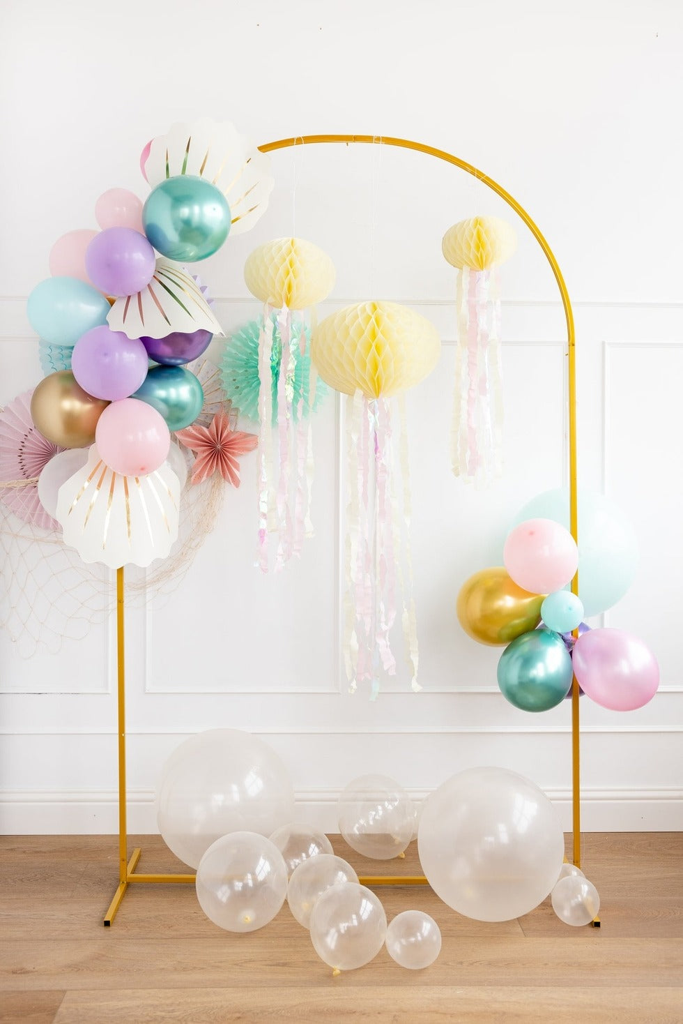 pastel mermaid balloon arch and yellow jellyfish decorations under the sea theme from Parte Haus party supply store in Bethesda MD