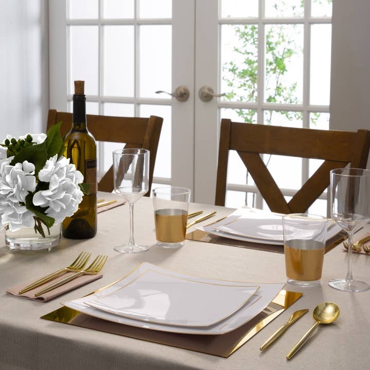 Gold and white tableware with gold cutlery for elegant dinner from Parte Haus party supply store in Bethesda MD