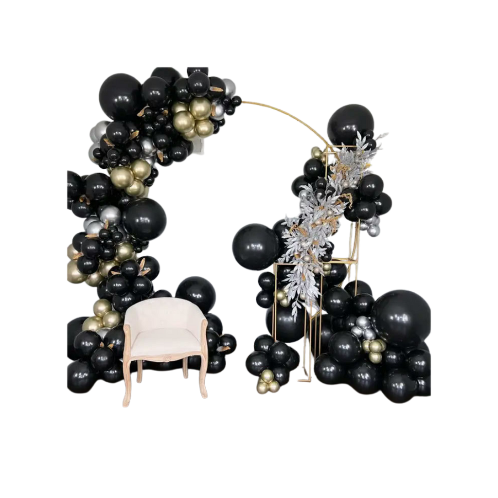Black and gold balloon arch with cream chair modern event decor from Parte Haus party supply store in Bethesda Maryland