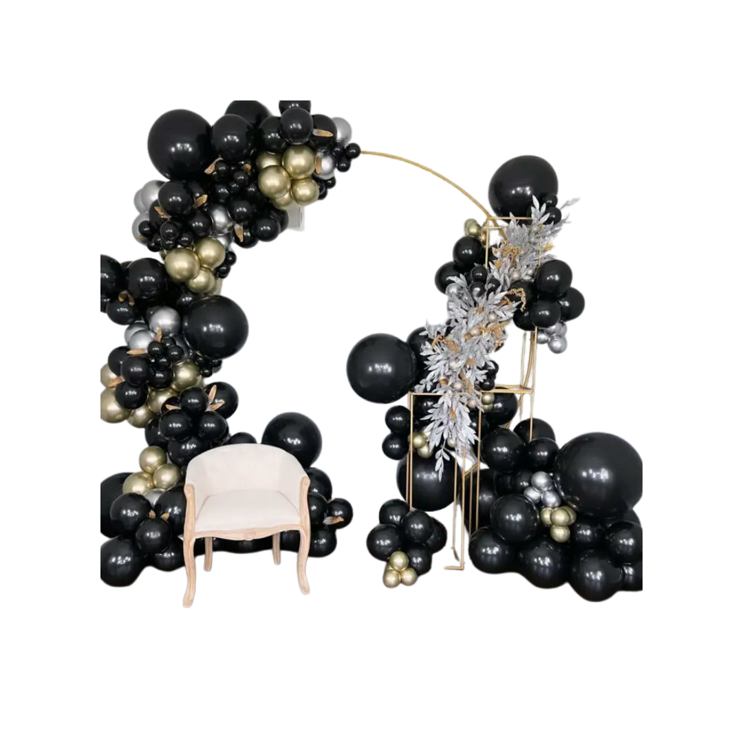 Black and gold balloon arch with cream chair modern event decor from Parte Haus party supply store in Bethesda Maryland