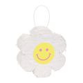 White flower pinata with yellow smiley face for birthday from Parte Haus party supply store in Bethesda MD
