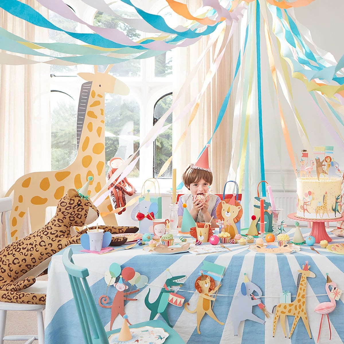 colorful animal theme birthday party table with decorations for kids from Parte Haus party supply store in Bethesda Maryland