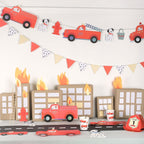 Red fire truck birthday decorations with flames and cityscape for kids party theme from Parte Haus party supply store in Bethesda MD