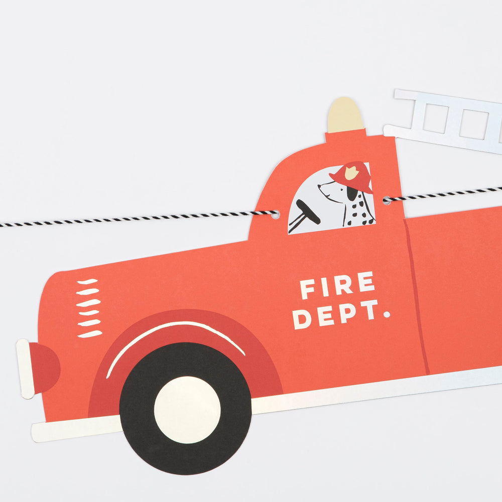 Red fire truck garland with dalmatian dog firefighter for kids birthday from Parte Haus party supply store in Bethesda MD