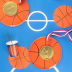 Orange basketball plates medals cup on blue basketball court theme from Parte Haus party supply store in Bethesda MD