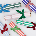 Colorful striped Christmas crackers with velvet bows for holiday celebration from Parte Haus party supply store in Bethesda Maryland
