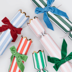 Colorful striped Christmas crackers with bows for holiday celebration from Parte Haus party supply store in Bethesda MD