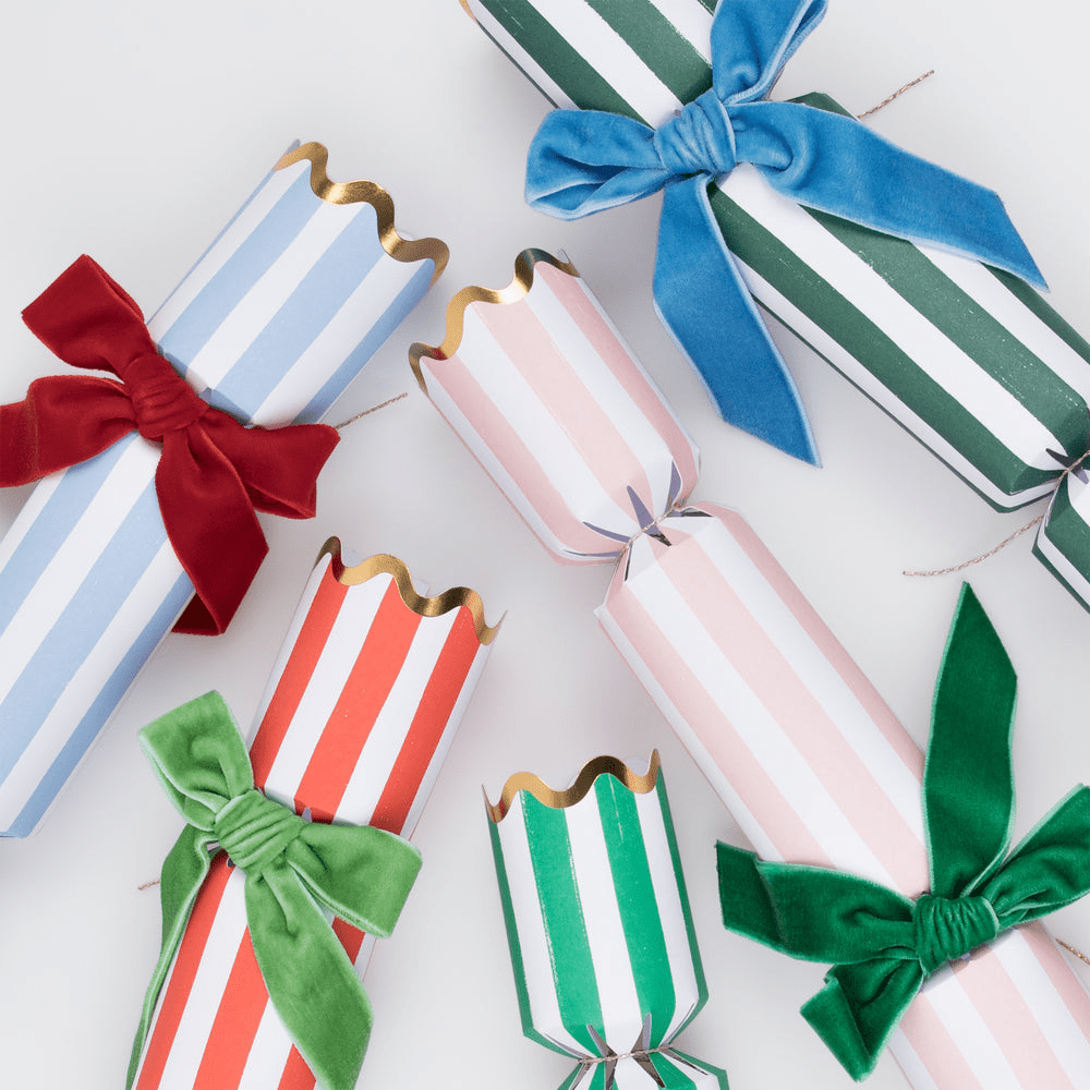 Colorful striped Christmas crackers with bows for holiday celebration from Parte Haus party supply store in Bethesda MD