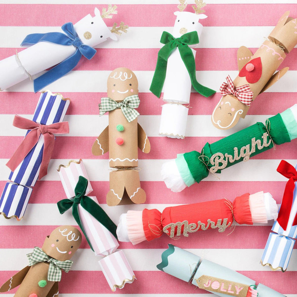 Multicolor Christmas cracker decorations with bows and festive text for holiday from Parte Haus party supply store in Bethesda MD