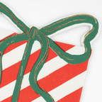 Red and white striped present napkin with green bow Christmas theme from Parte Haus party supply store in Bethesda Maryland