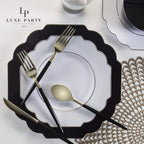 Black and white elegant plate set with gold cutlery for formal celebration from Parte Haus party supply store in Bethesda MD.