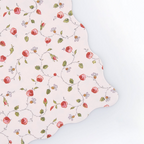 Pink floral scalloped edge plate with red roses and green leaves for a tea party from Parte Haus party supply store in Bethesda MD
