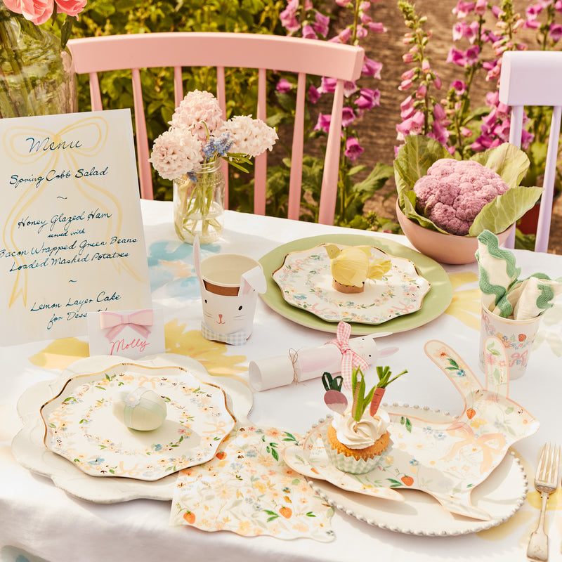 Pastel floral paper plates bunny cups and napkins Easter garden table from Parte Haus party supply store in Bethesda Maryland