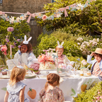 Pastel Easter table decorations with children in bunny ear headbands for spring party from Parte Haus party supply store in Bethesda, Maryland