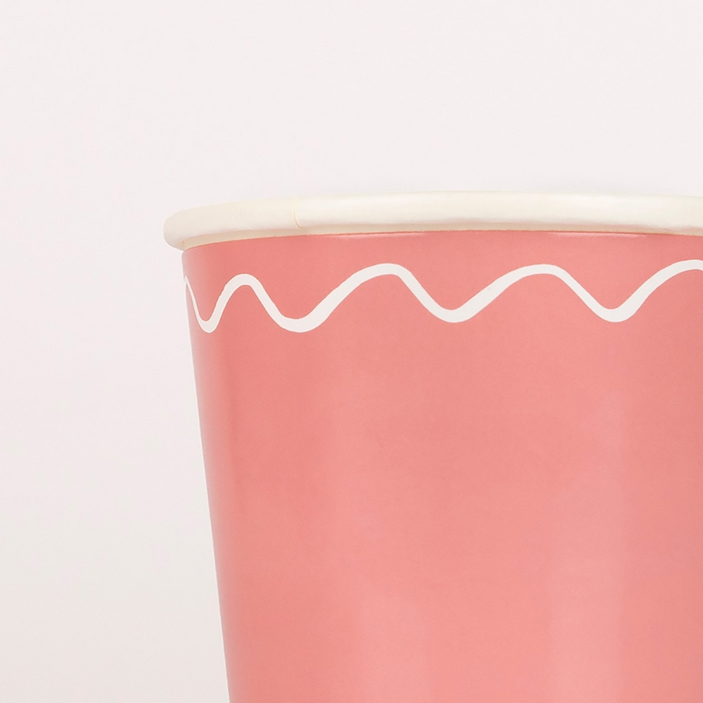 Pink paper cup with white wavy line design for birthday celebration from Parte Haus party supply store in Bethesda MD