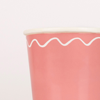 Pink paper cup with white wavy line design for birthday celebration from Parte Haus party supply store in Bethesda MD