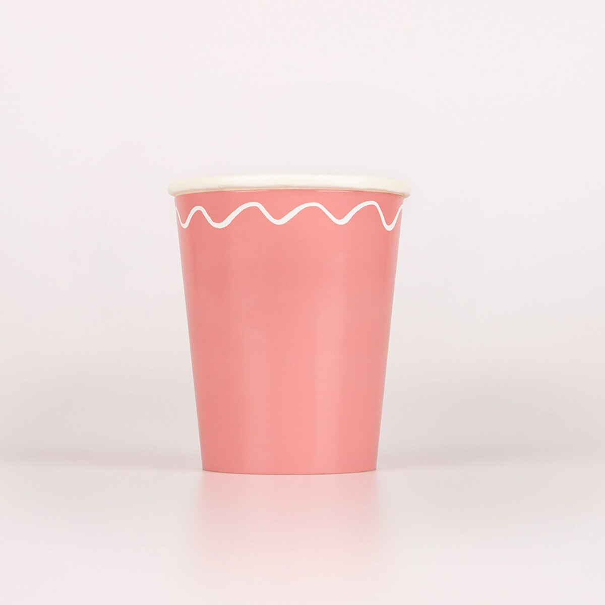 Pink paper cup with white wavy line for birthday from Parte Haus party supply store in Bethesda MD