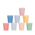 Pastel assorted paper cups with white scalloped trim stack birthday from Parte Haus party supply store in Bethesda Maryland