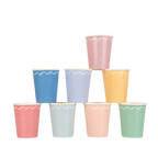 Pastel assorted paper cups with white scalloped trim stack birthday from Parte Haus party supply store in Bethesda Maryland