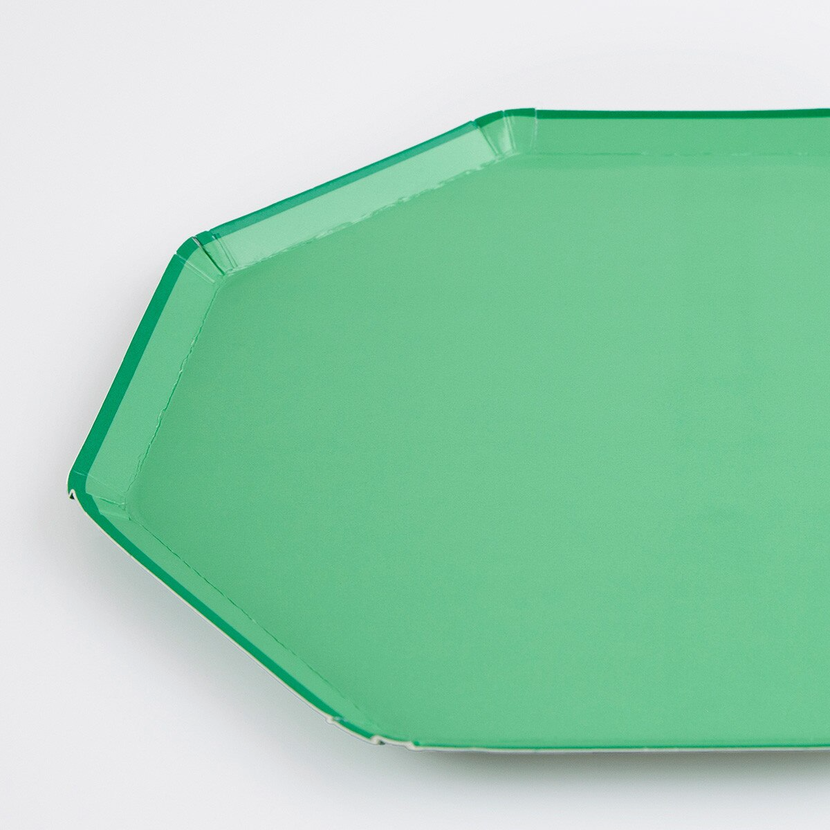 Green paper plate with octagon shape for birthday or celebration from Parte Haus party supply store in Bethesda, Maryland