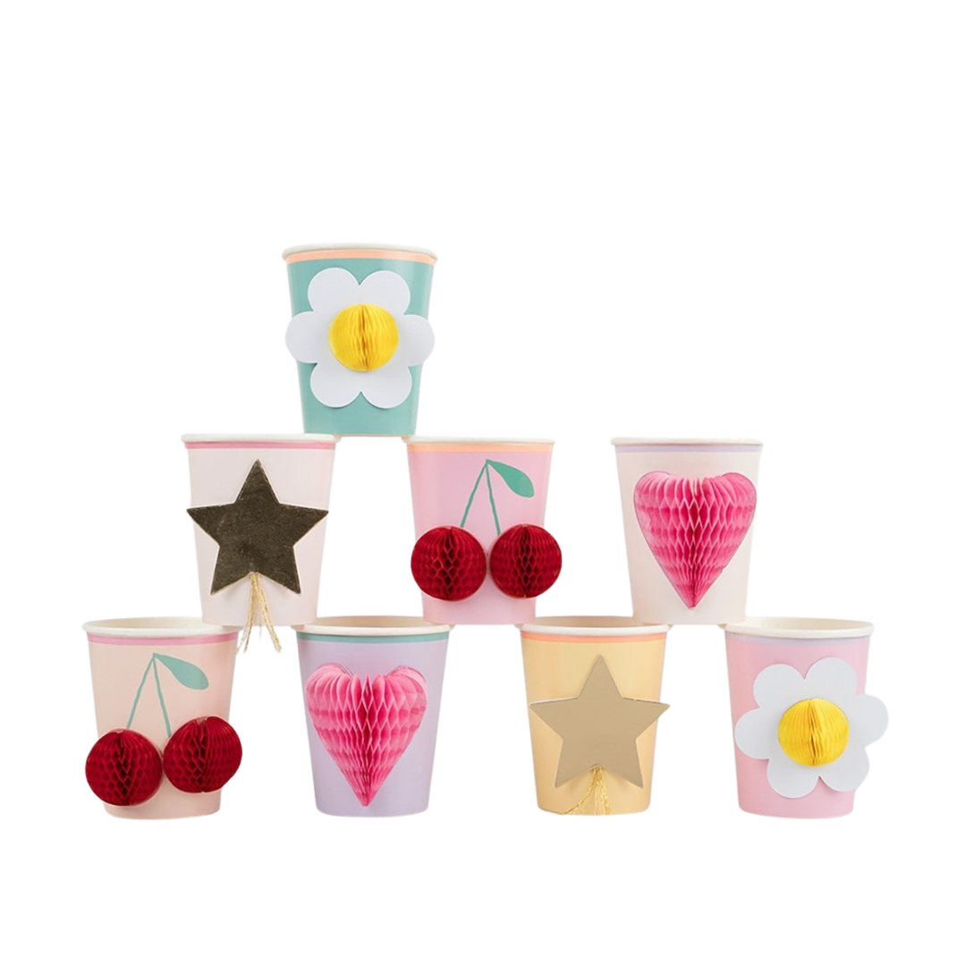 Colorful paper cups with cherry daisy heart and star decorations for birthday theme from Parte Haus party supply store in Bethesda MD