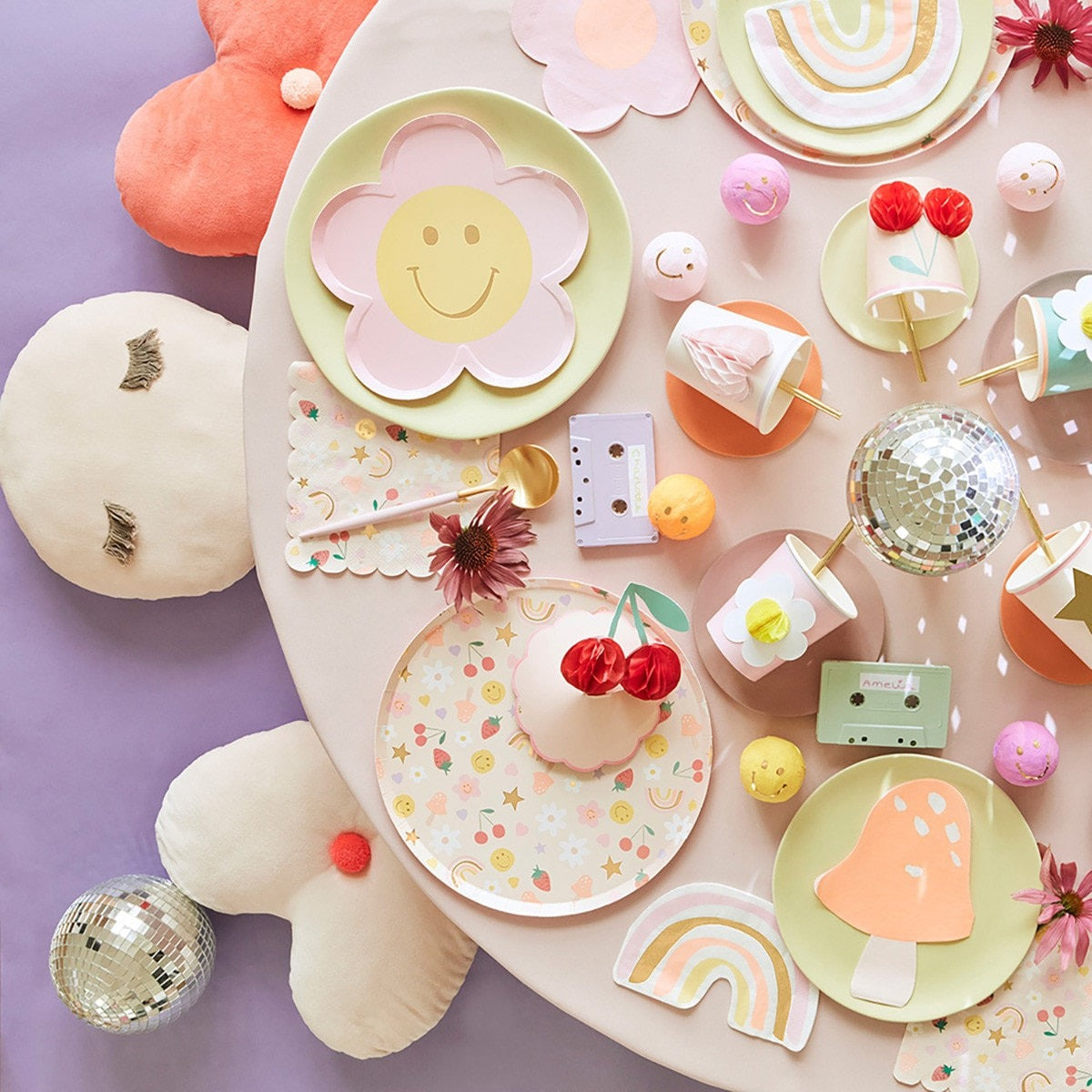 Pastel flower and rainbow paper plates with smiley designs spring birthday decor from Parte Haus party supply store in Bethesda Maryland