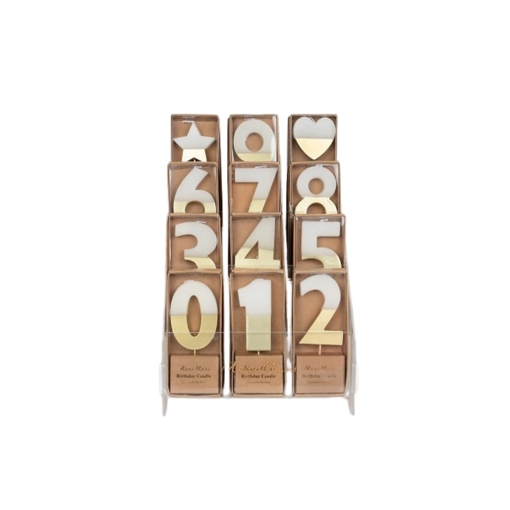 Gold and white number birthday candles display for celebration from Parte Haus party supply store in Bethesda MD.