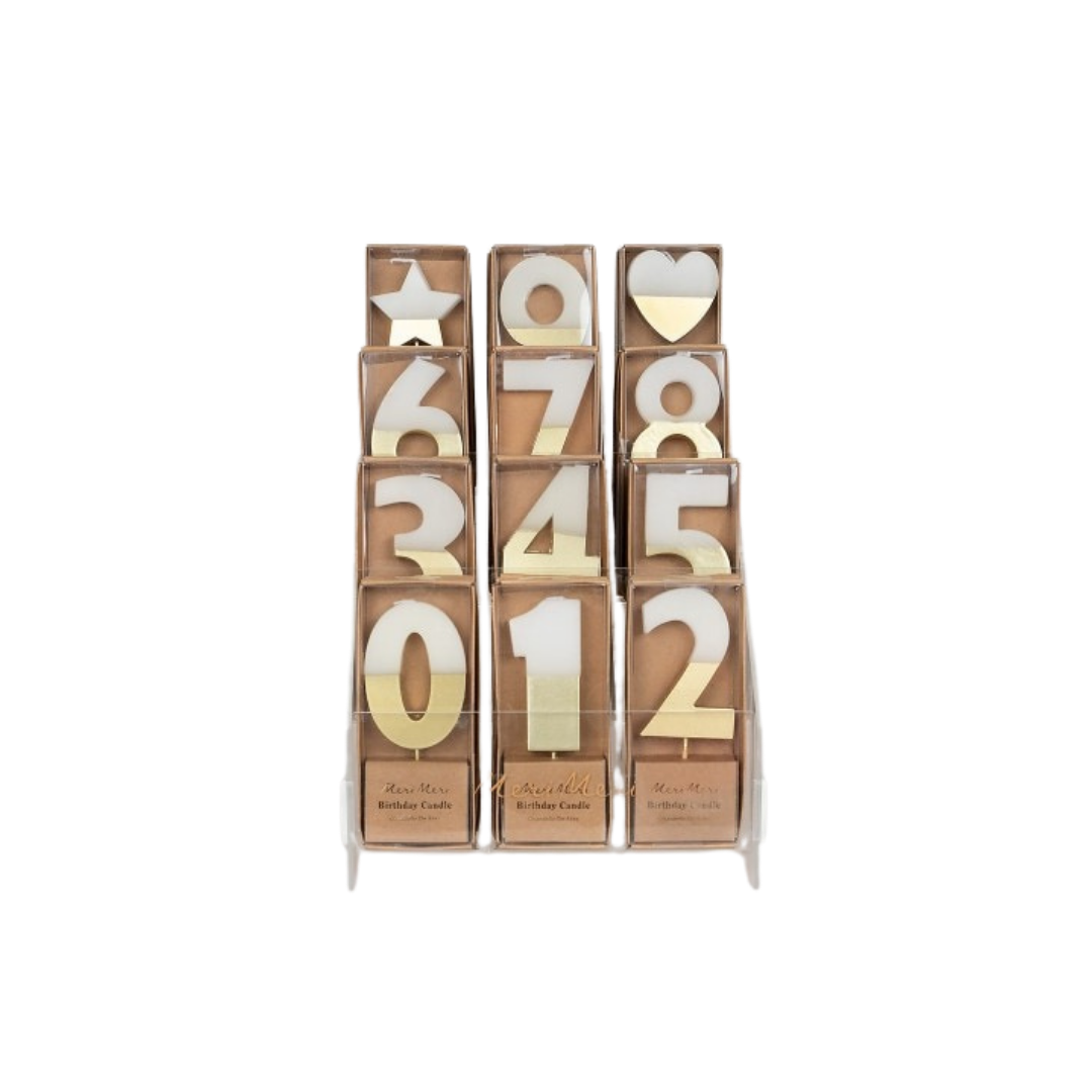 Gold and white number birthday candles display for celebration from Parte Haus party supply store in Bethesda MD.