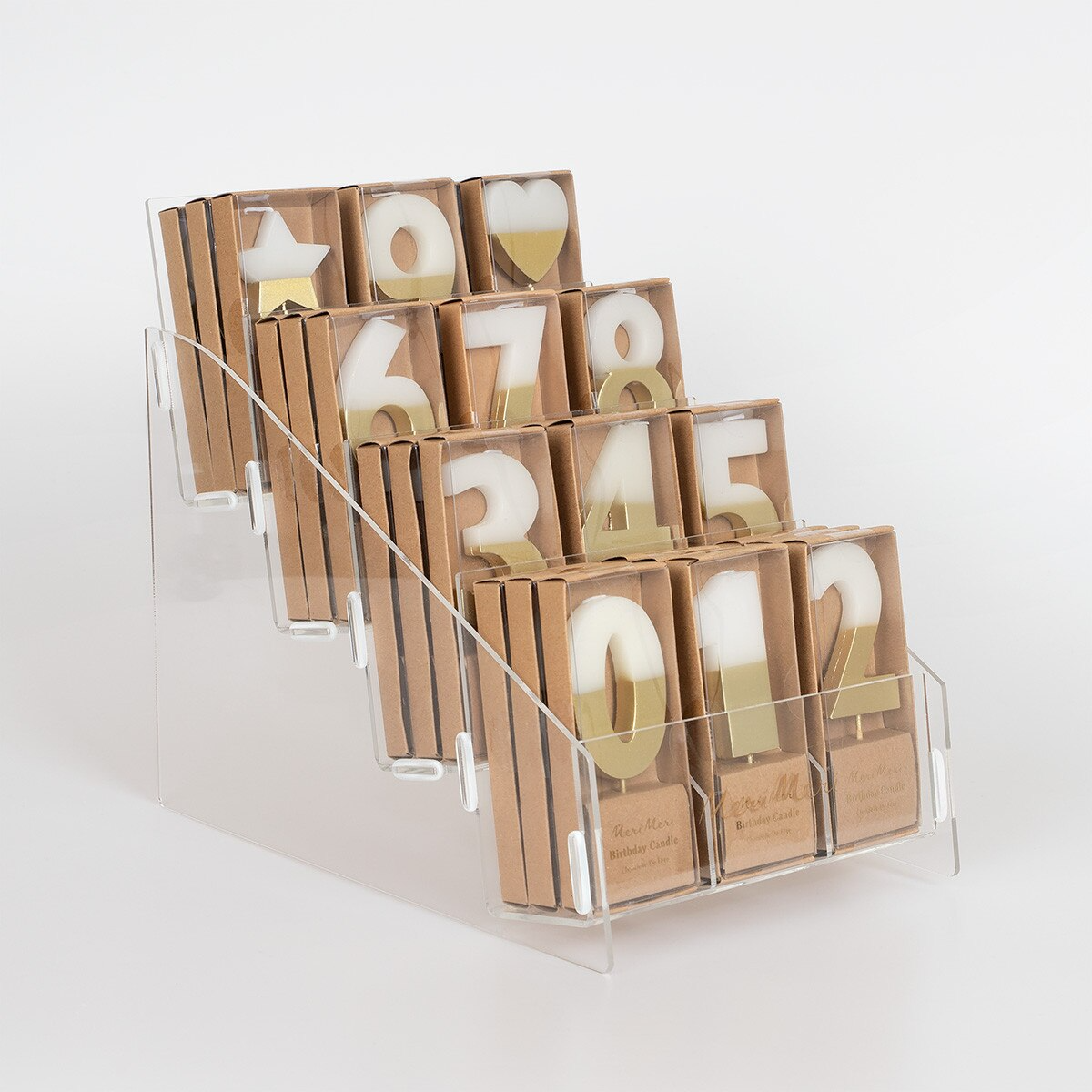 Gold and white number birthday candles in display stand for celebration from Parte Haus party supply store in Bethesda Maryland