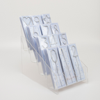 Silver number and shape cake toppers in a clear display for birthday from Parte Haus party supply store in Bethesda MD