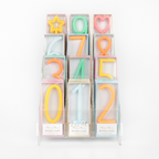 Pastel number and shape birthday candles display for birthday theme from Parte Haus party supply store in Bethesda MD.