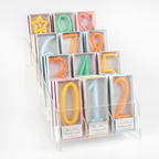 Colorful number and shape birthday candles in boxes for birthday from Parte Haus party supply store in Bethesda Maryland