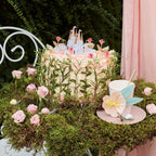 Pink princess castle themed cake with floral decorations for birthday from Parte Haus party supply store in Bethesda MD